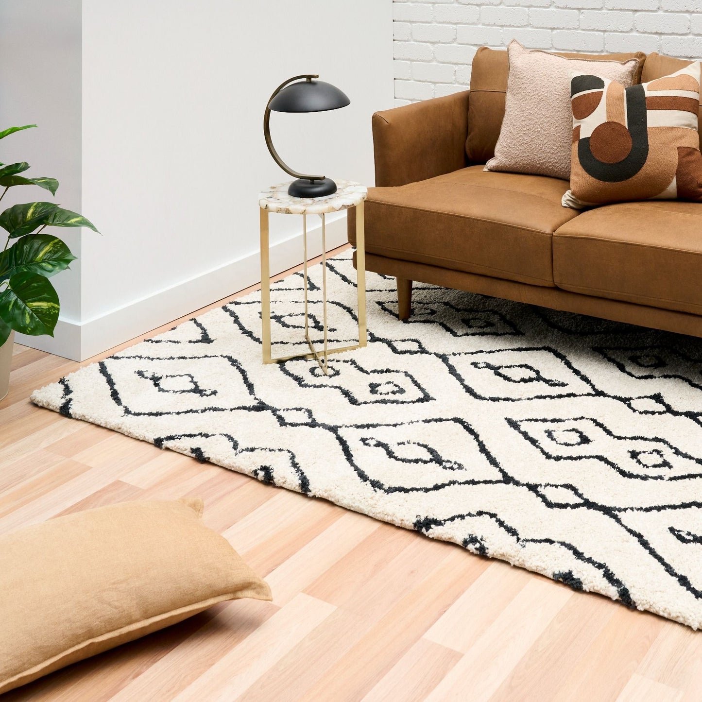 Luana Column Ivory Charcoal is a machine made polypropylene rug.  It features a shaggy pile with a moroccan boho inspired design. Colours Ivory with a charcoal moroccan inspired diamond pattern. Sizes 160 X 230, 200 X 290, 240 X 320 and 300 X 390. Styled.