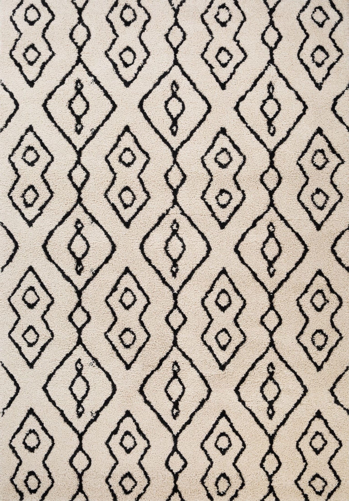 Luana Column Ivory Charcoal is a machine made polypropylene rug.  It features a shaggy pile with a moroccan boho inspired design. Colours Ivory with a charcoal moroccan inspired diamond pattern. Sizes 160 X 230, 200 X 290, 240 X 320 and 300 X 390. Top.