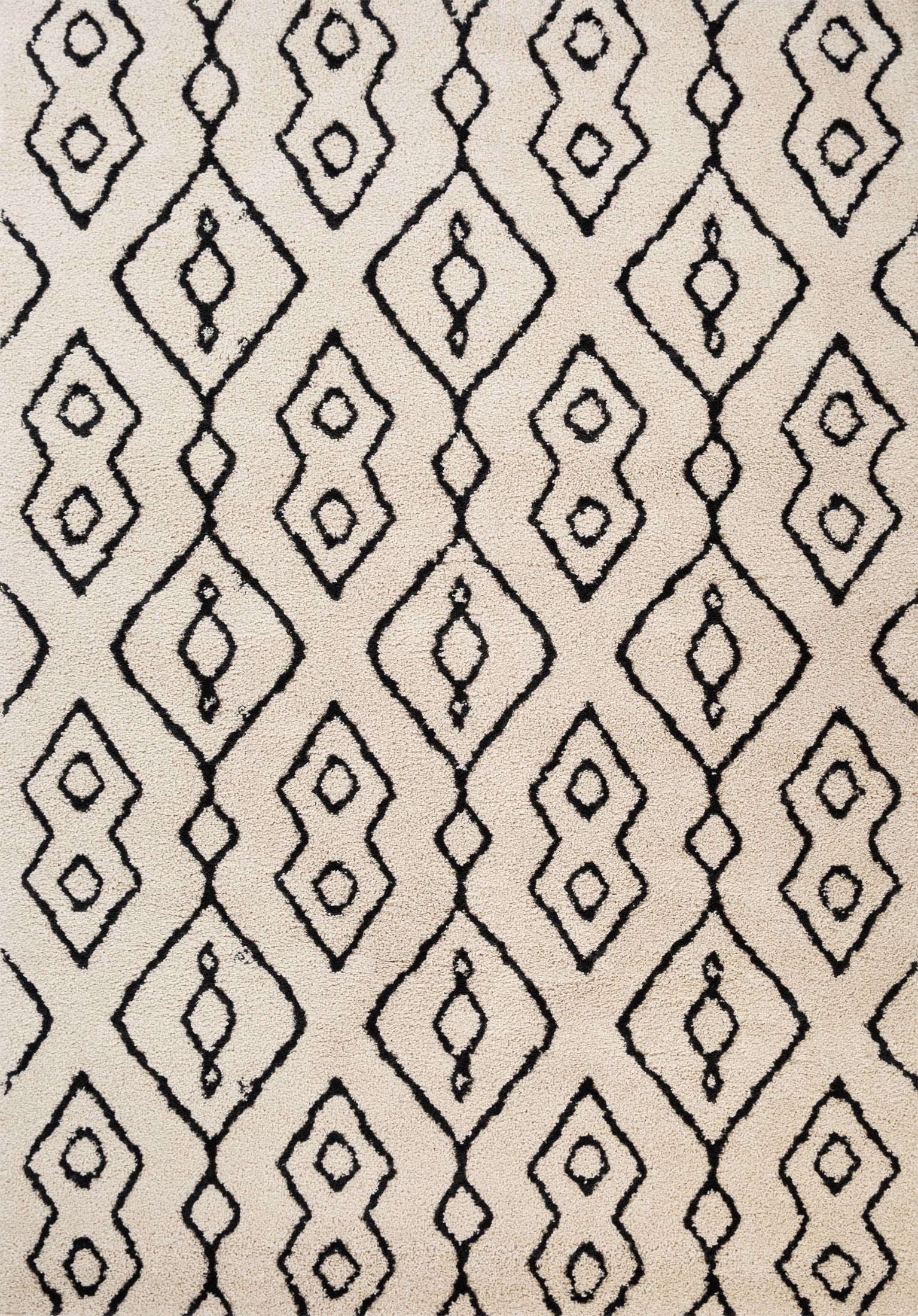 Luana Column Ivory Charcoal is a machine made polypropylene rug.  It features a shaggy pile with a moroccan boho inspired design. Colours Ivory with a charcoal moroccan inspired diamond pattern. Sizes 160 X 230, 200 X 290, 240 X 320 and 300 X 390. Top.