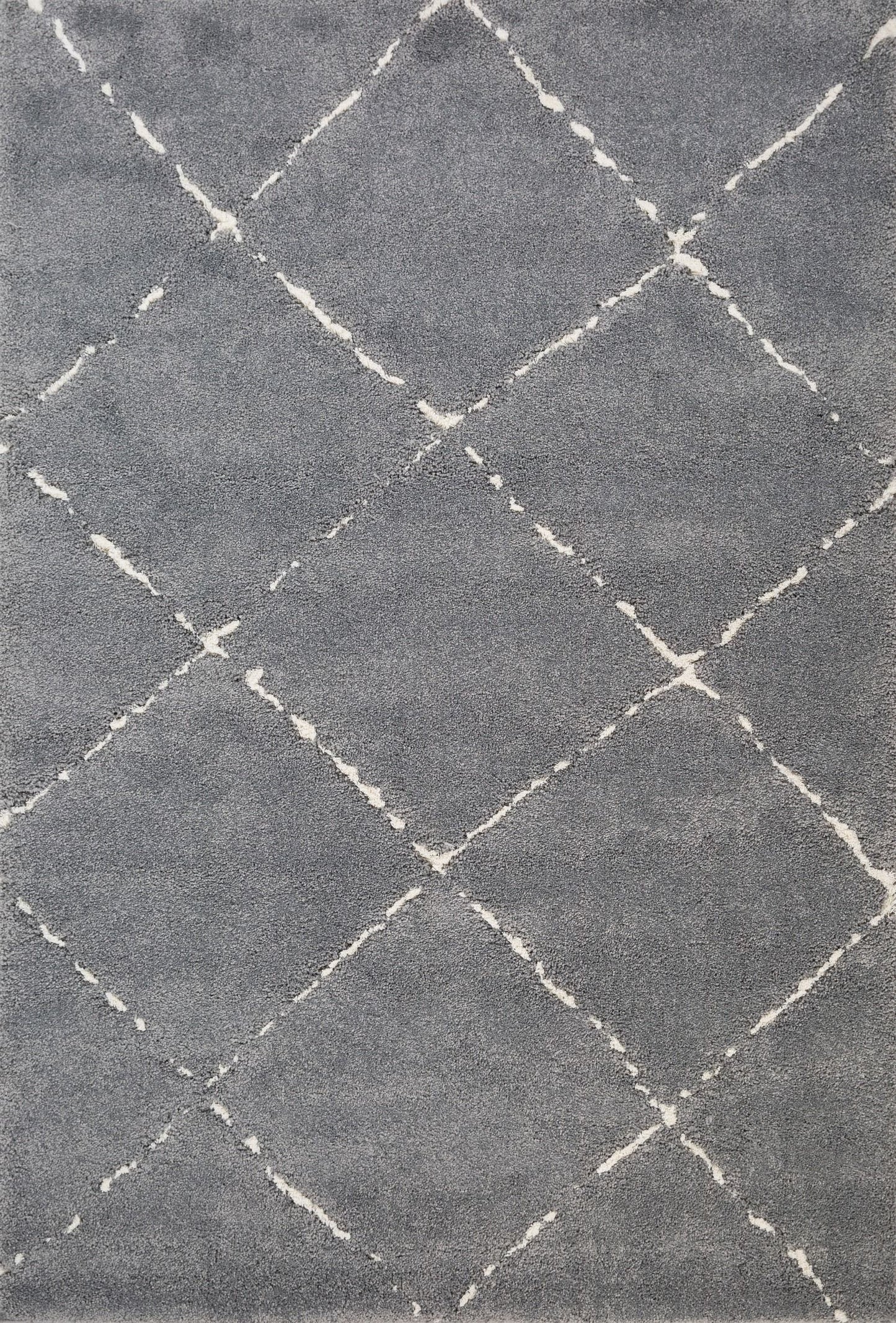 Luana Diamond Grey Ivory is a machine made polypropylene rug.  It features a shaggy pile with a moroccan boho inspired design. Colours Grey with Ivory White Diamond pattern. Sizes 160 X 230, 200 X 290, 240 X 320 and 300 X 390. Top.