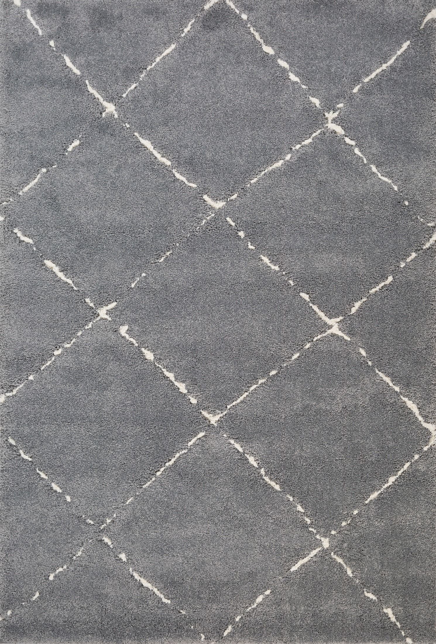 Luana Diamond Grey Ivory is a machine made polypropylene rug.  It features a shaggy pile with a moroccan boho inspired design. Colours Grey with Ivory White Diamond pattern. Sizes 160 X 230, 200 X 290, 240 X 320 and 300 X 390. Top.