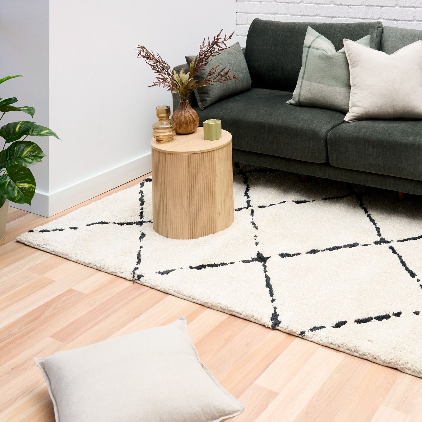 Luana Diamond Ivory Charcoal is a machine made polypropylene rug.  It features a shaggy pile with a moroccan boho inspired design. Colours Ivory with a charcoal diamond pattern. Sizes 160 X 230, 200 X 290, 240 X 320 and 300 X 390. Styled.