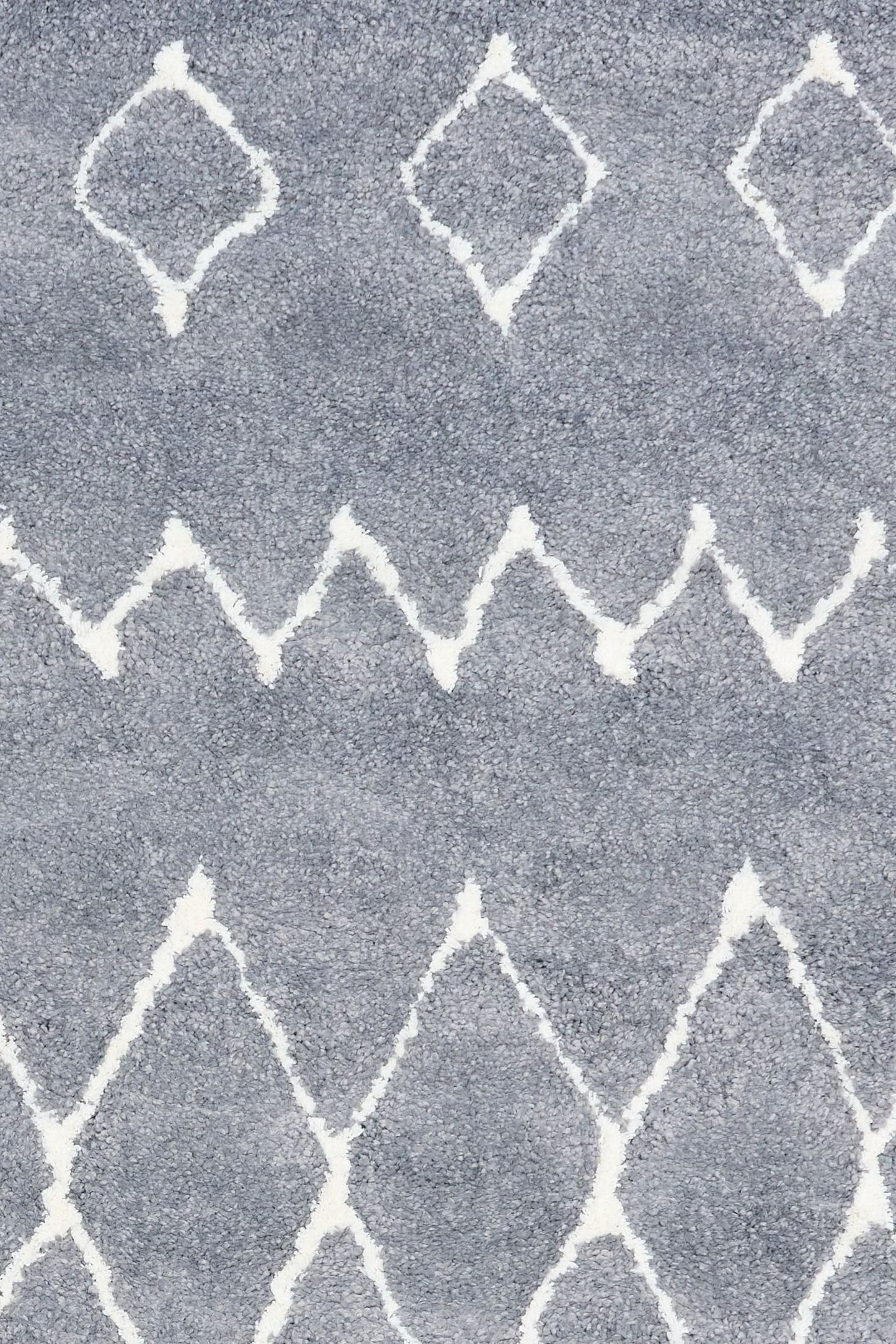 Luana Grey Ivory 1215 is a machine made polypropylene rug.  It features a shaggy pile with a moroccan boho inspired design. Colours Grey with Ivory White patterns. Sizes 160 X 230, 200 X 290, 240 X 320 and 300 X 390. Close.