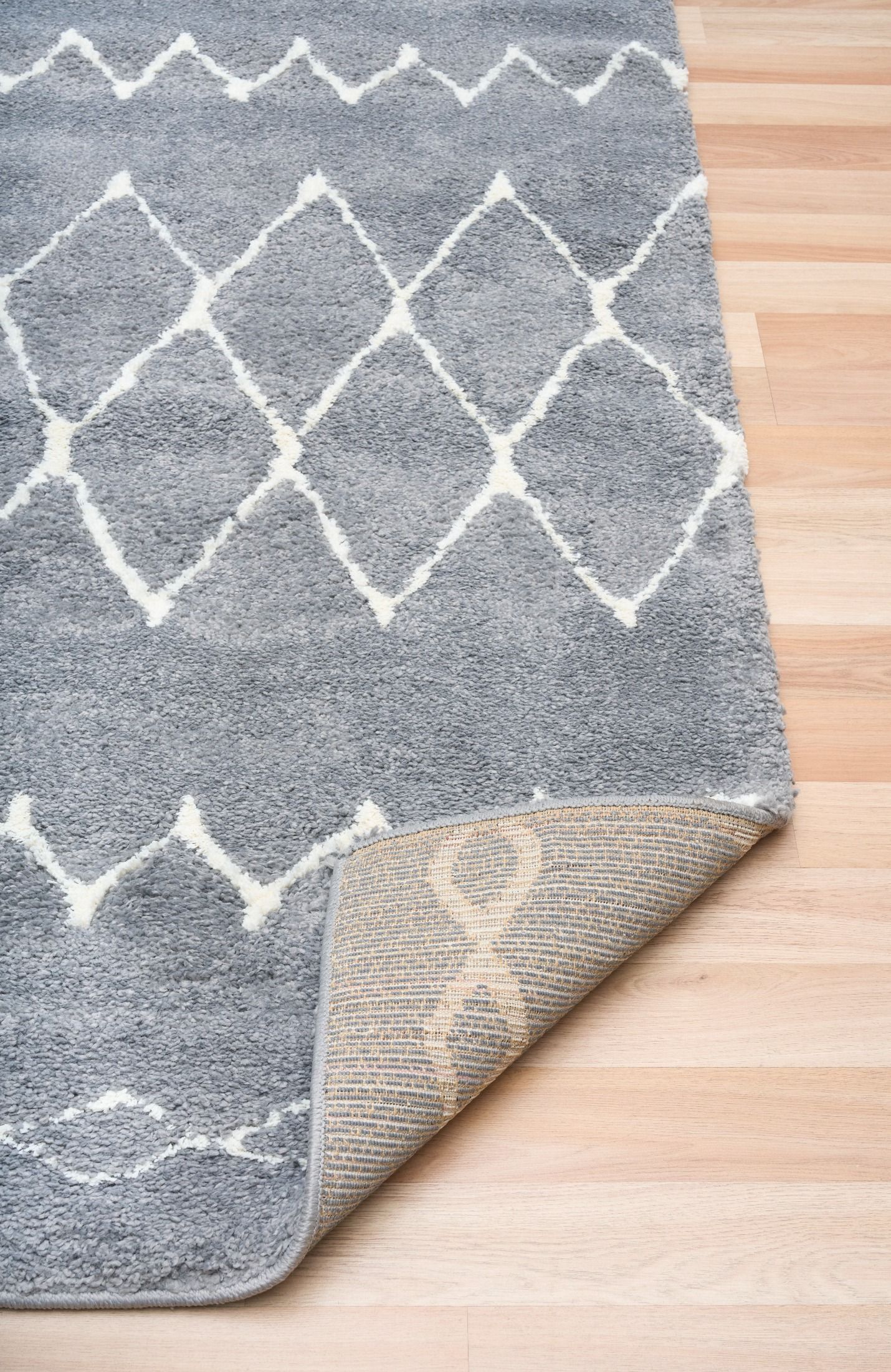 Luana Grey Ivory 1215 is a machine made polypropylene rug.  It features a shaggy pile with a moroccan boho inspired design. Colours Grey with Ivory White patterns. Sizes 160 X 230, 200 X 290, 240 X 320 and 300 X 390. Fold.