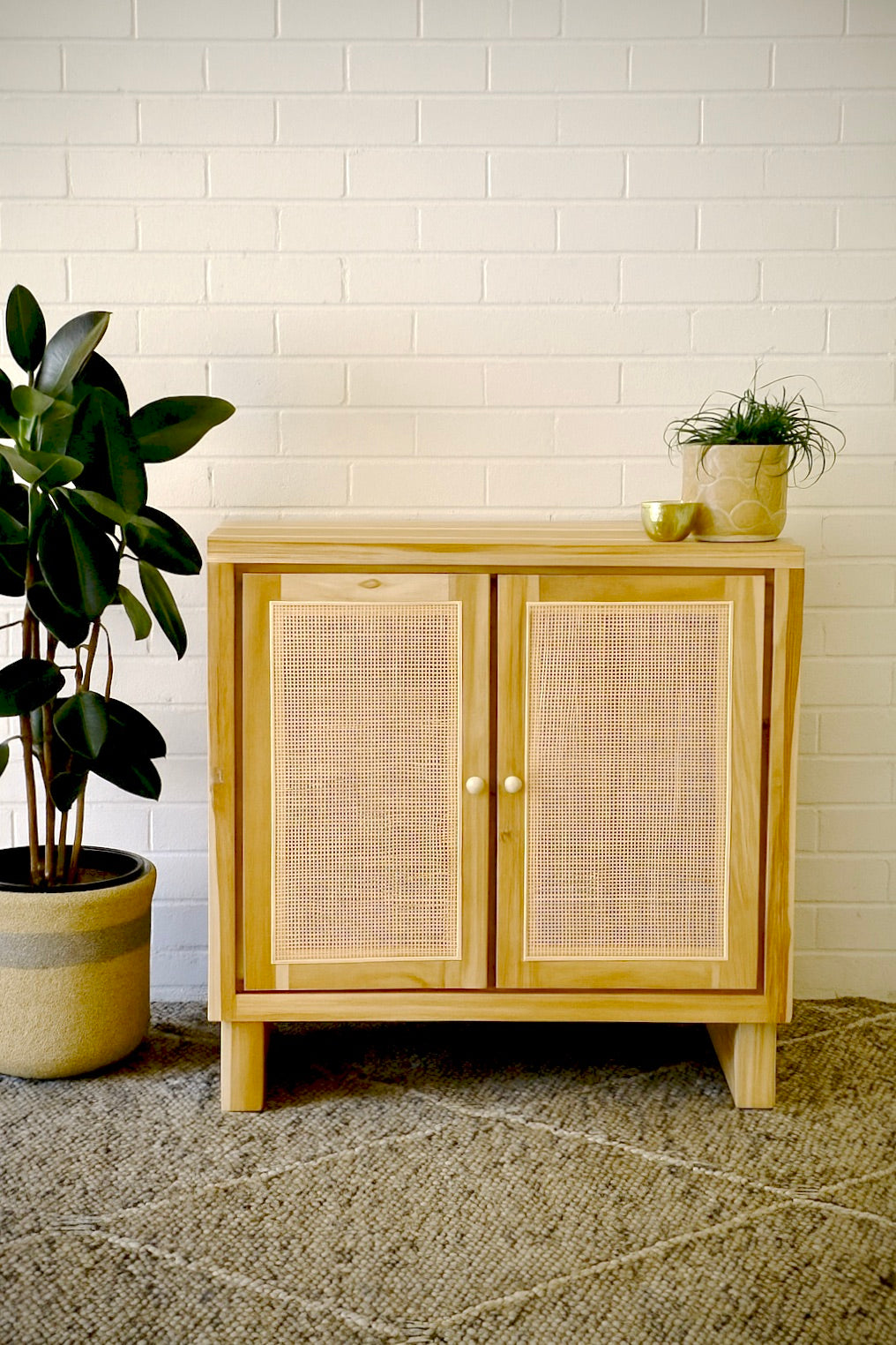 The Manzanita 2 Door Buffet is a contemporary and coastal two-door sideboard crafted from sustainable teak. The sideboard features open mesh rattan doors. Colour natural. Measures 800 wide X 400 depth X 900 height. Styled.