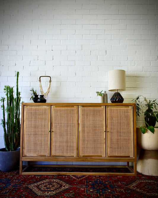 The Manzanita 4 Door Buffet is a contemporary and coastal four-door sideboard crafted from sustainable teak. The sideboard features open mesh rattan doors. Colour natural. Measures 1500 length X 400 depth X 950 height. Front Styled.