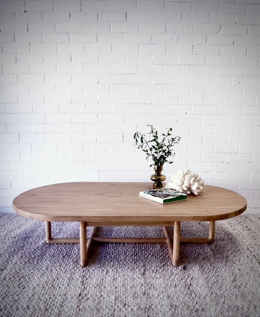 The Marley Coffee Table, an eye-catching contemporary coffee table crafted from natural teak. Measures 1600 Length x 900 Width x 370 Height. Styled.