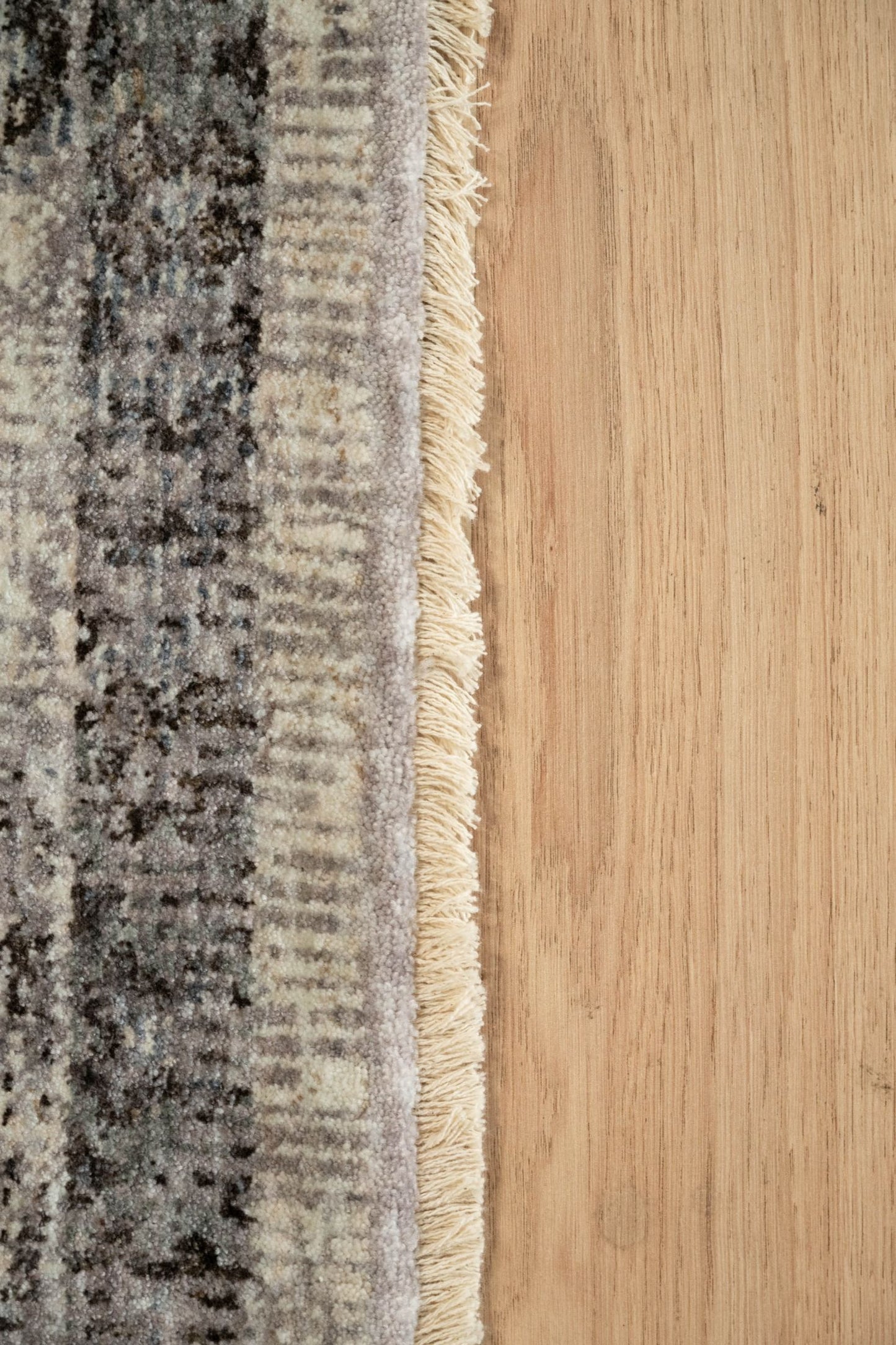 The Matana Grey 7 Rug. Traditional style, machine made rug. Colours light grey, grey and dark grey. Sizes 160 X 235, 200 X 285, 240 X 330 and 300 X 400. Edge.