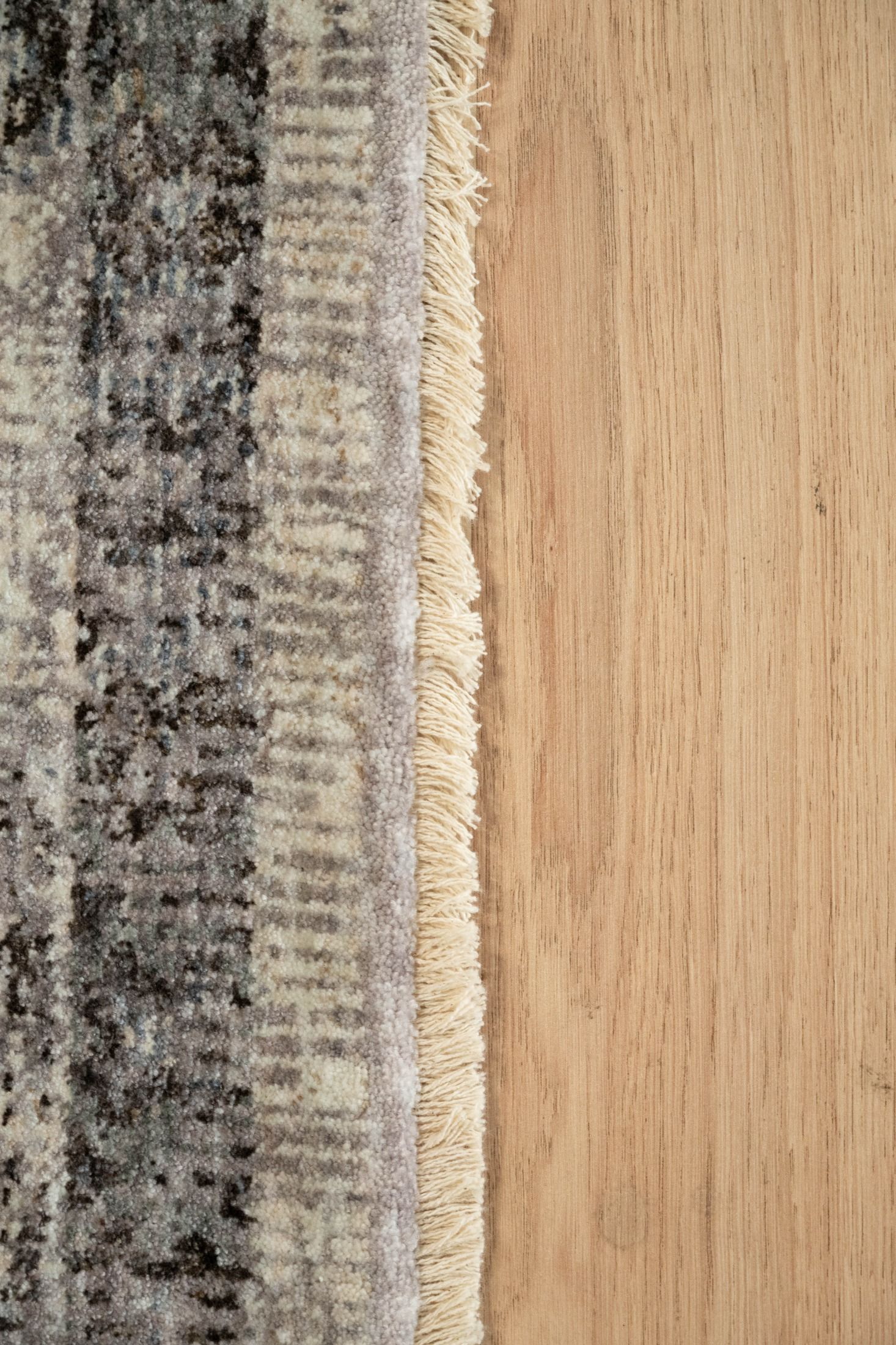 The Matana Grey 7 Rug. Traditional style, machine made rug. Colours light grey, grey and dark grey. Sizes 160 X 235, 200 X 285, 240 X 330 and 300 X 400. Edge.