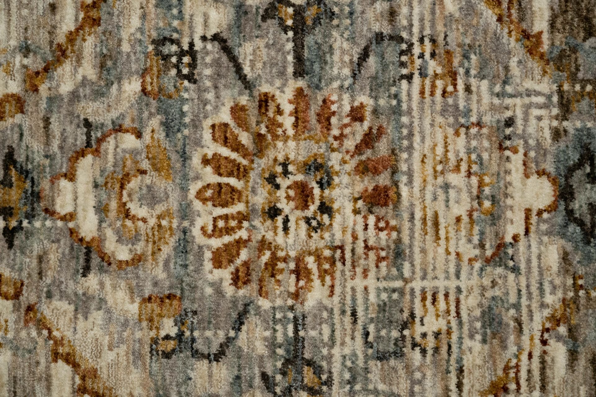 The Matana Multi 7 Rug. Traditional style, machine made rug. Colours light grey, grey, brown and beige. Sizes 160 X 235, 200 X 285, 240 X 330 and 300 X 400. Close.