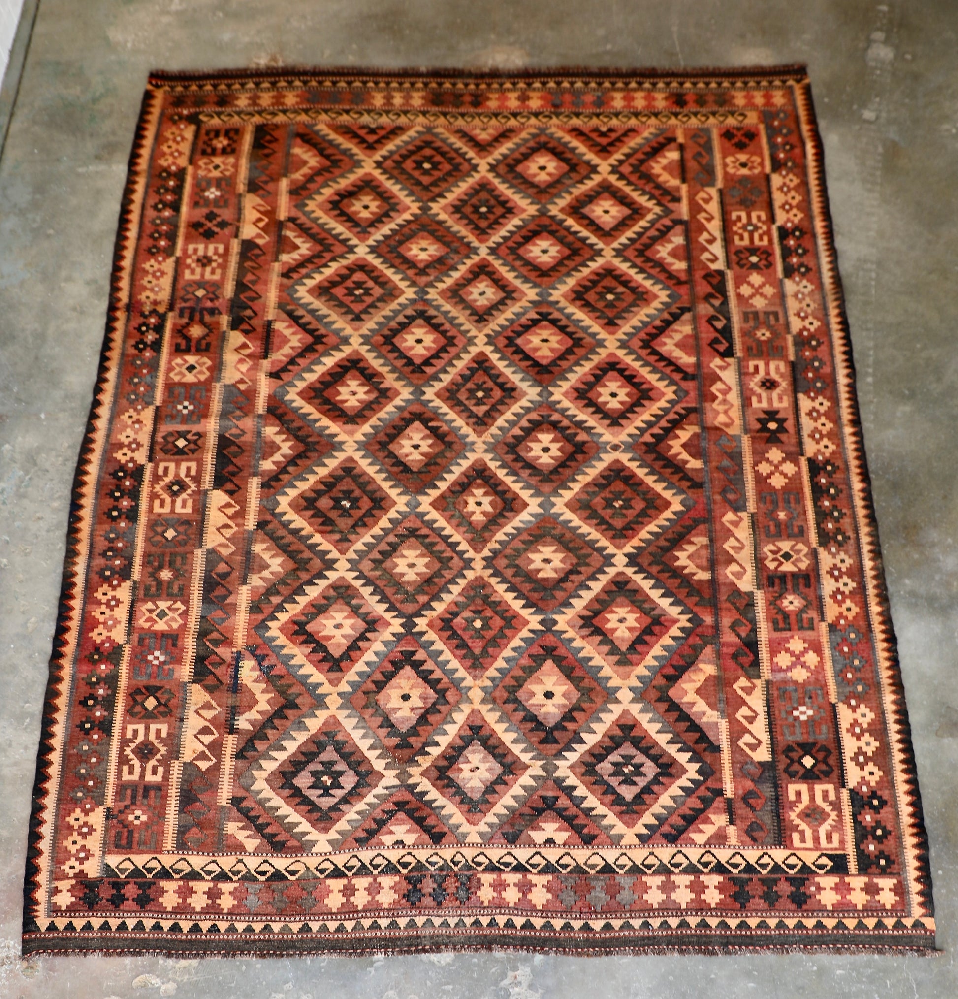 The Afghan Hand Woven Maimana Kilim - 251 X 344.  Crafted from wool and featuring traditional Afghan weaving techniques. Colours, red, orange, black. Size 251 wide X 344 long. Front.