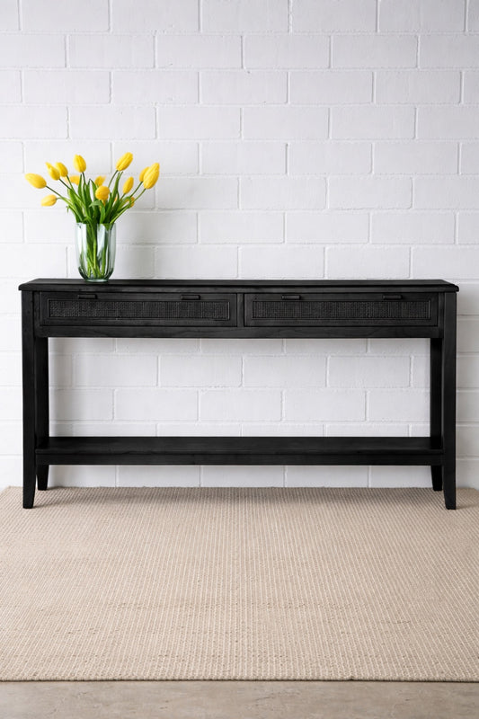 The Milan 2 Drawer Black console boasts coastal and contemporary style. Crafted from sustainable white cedar timber, it features 2 drawers, on wooden runners, and an open mesh rattan drawer face. Colour Black. Measures 1500 length X 250 depth X 750 height. Front Styled.
