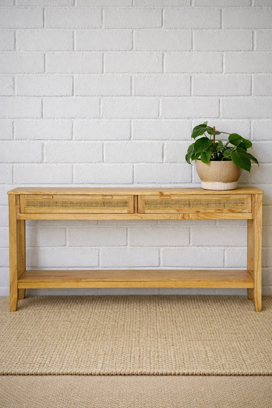 The Milan - 2 Drawer Natural console boasts coastal and contemporary style. Crafted from sustainable white cedar timber, it features 2 drawers, on wooden runners, and an open mesh rattan drawer face. Colour Natural. Measures 1500 length X 250 depth X 750 height. Front Styled.
