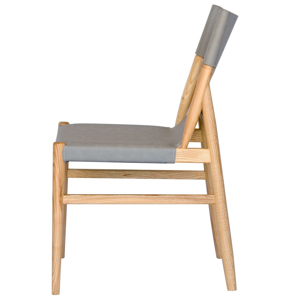 The Modoc - Grey Dining Chair blends style & durability with a solid ash frame & grey saddle leather, perfect for modern, minimalist & coastal spaces. Measures 500 Wide x 570 Depth x 450 Seat Height. Back Height 830. Colour Natural Frame with Grey seat and back. Side.