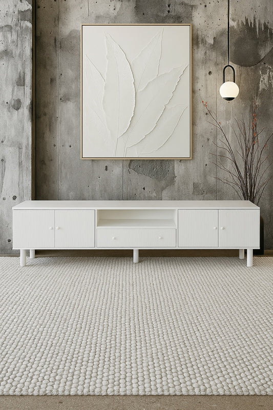 The Monroe 4 Door 1 Drawer White Entertainment Unit is a contemporary piece of furniture. Crafted from solid white cedar, it comes with four textured doors and a shelf and 1 drawer. Colour White. Measures 2100 length X 400 depth X 530 height. Styled.