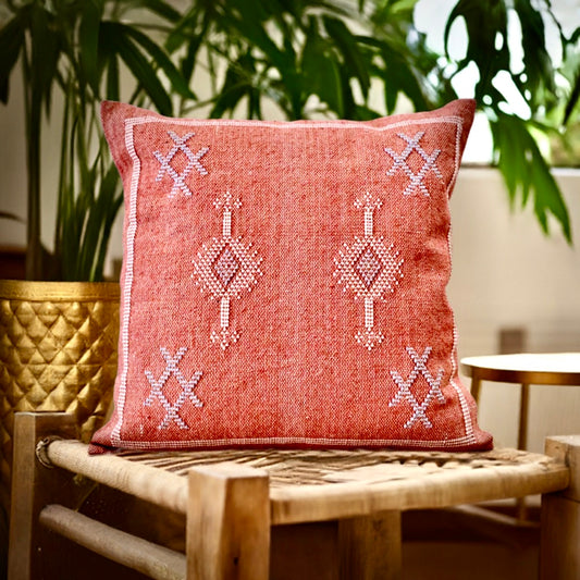 The Moroccan Burnt Orange Cushion is hand crafted in India. Features a cotton weave with hidden zip on the back. This Moroccan inspired design will bring a boho feel to any area. Colours, orange, cream and blues. Measures 50 X 50. Styled.