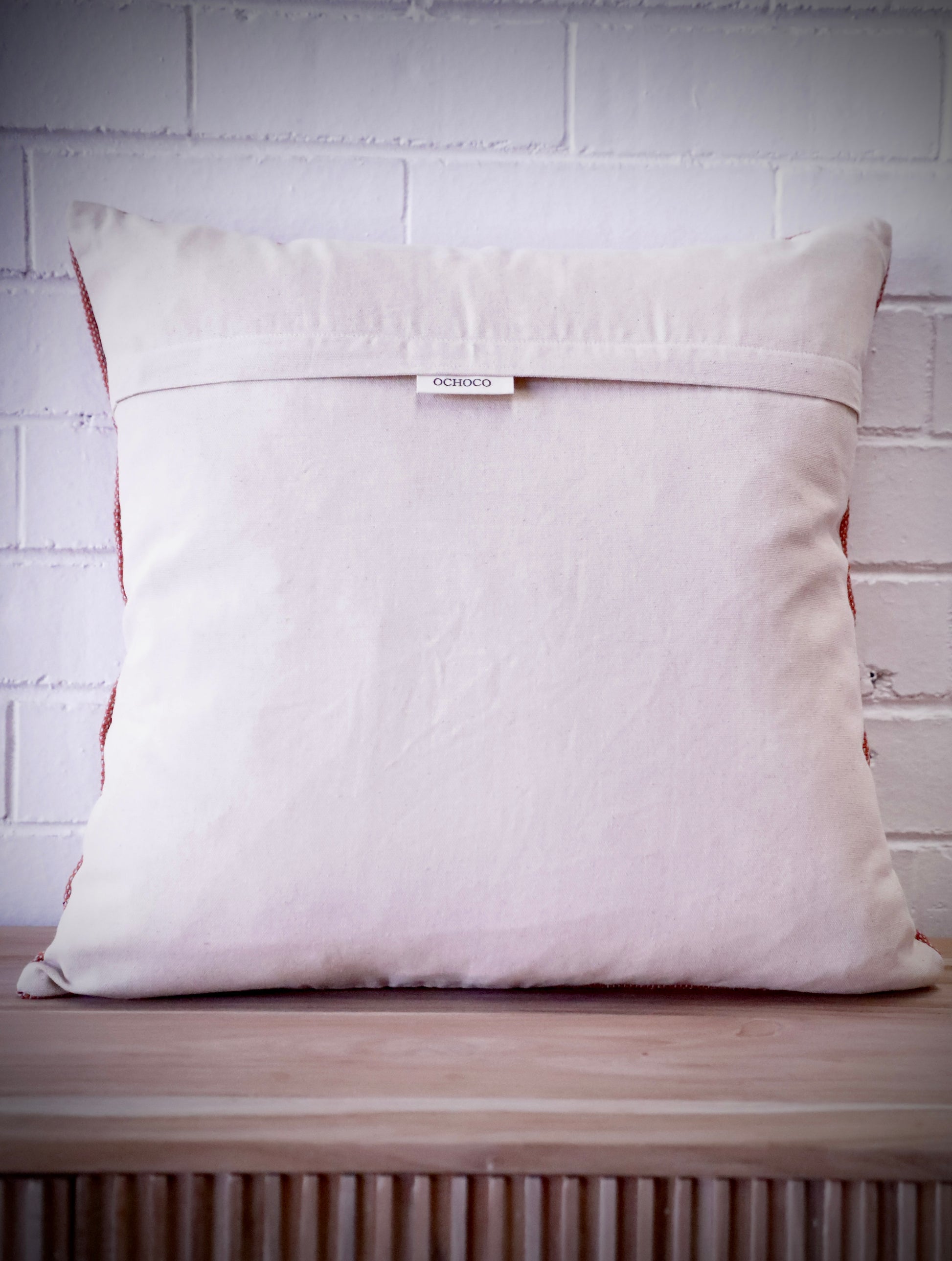 The Moroccan Burnt Orange Cushion is hand crafted in India. Features a cotton weave with hidden zip on the back. This Moroccan inspired design will bring a boho feel to any area. Colours, orange, cream and blues. Measures 50 X 50. Back.
