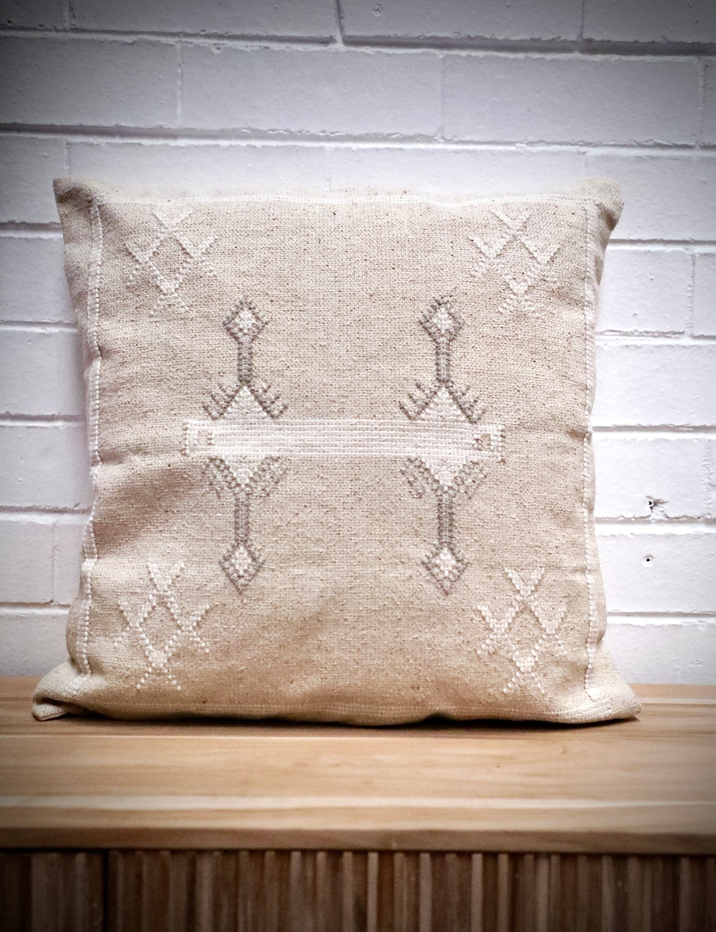 The Moroccan Cloud Cushion is a hand woven cotton weave with hidden zip on the back. Inspired by Moroccan motif's, its sure to bring a Moroccan feel to any area. Colours, light grey and white. Measures 50 X 50. Front.