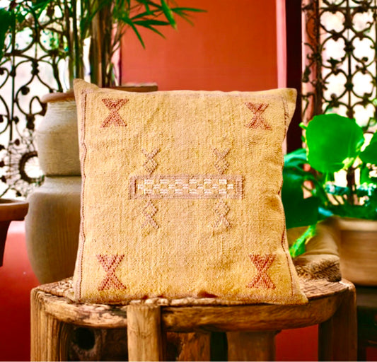 The Moroccan Mustard Yellow Cushion is hand made and features a cotton weave with hidden zip on the back. The Moroccan inspired motif's will bring a tribal feel to any area. Colours, light yellow, cream, brown and blues. Measures 50 X 50. Styled.