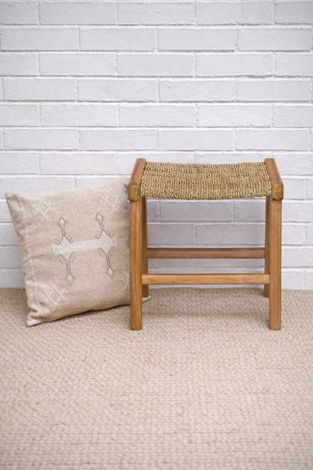 The Omono Foot Stool is crafted from sustainable seagrass with a teak frame. Colours natural. Measures 400 wide X 370 Depth x 420 height. Styled.