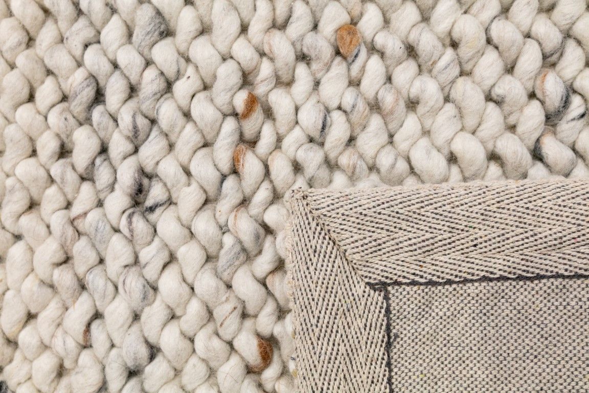 Oslo Greyology 1364 is a textured hand woven, piled loop wool rug. Colours white with grey,  black and brown accents. Sizes 155 X 225, 200 X 290, 240 X 320 and 300 X 400. Fold.