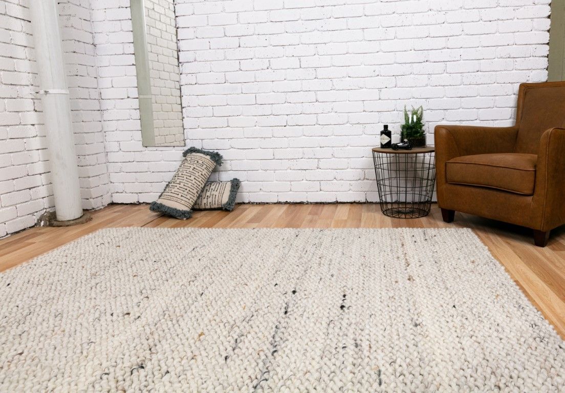 Oslo Greyology 1364 is a textured hand woven, piled loop wool rug. Colours white with grey,  black and brown accents. Sizes 155 X 225, 200 X 290, 240 X 320 and 300 X 400. Life.