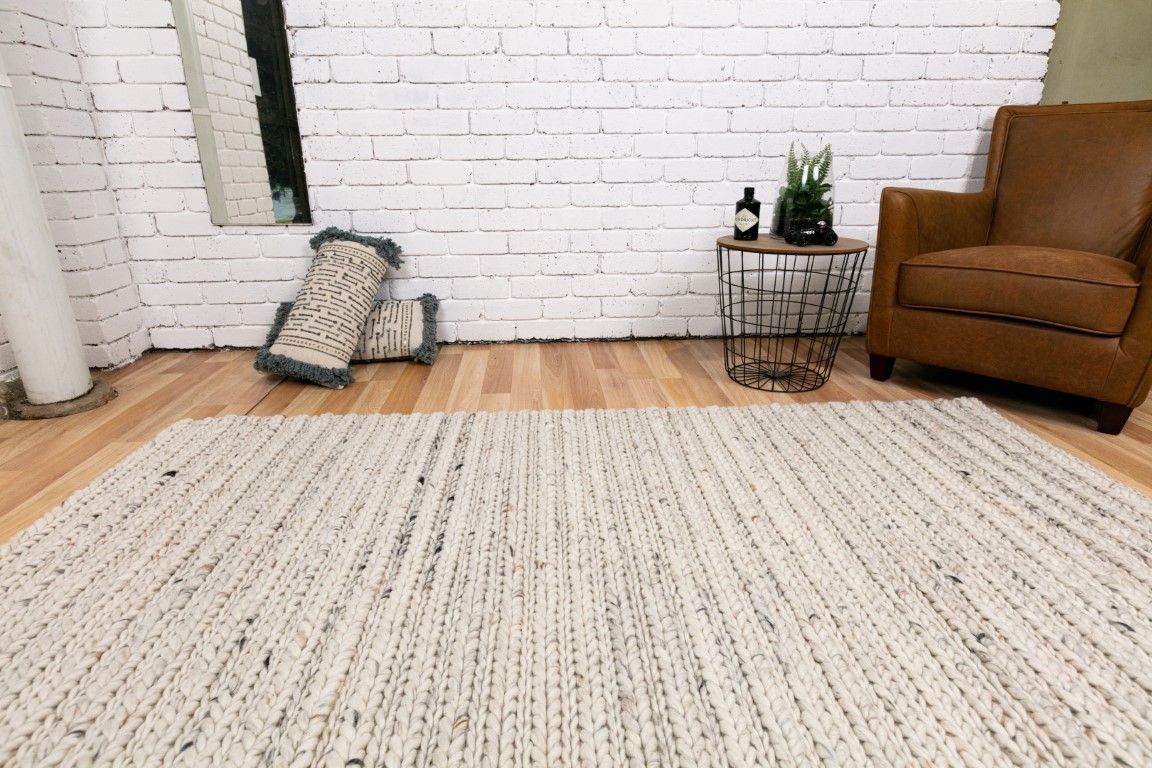 Oslo Greyology 1392 is a textured hand woven,  braided piled wool rug. Colours white with grey,  black and brown accents. Sizes 155 X 225, 200 X 290, 240 X 320 and 300 X 400. Life.