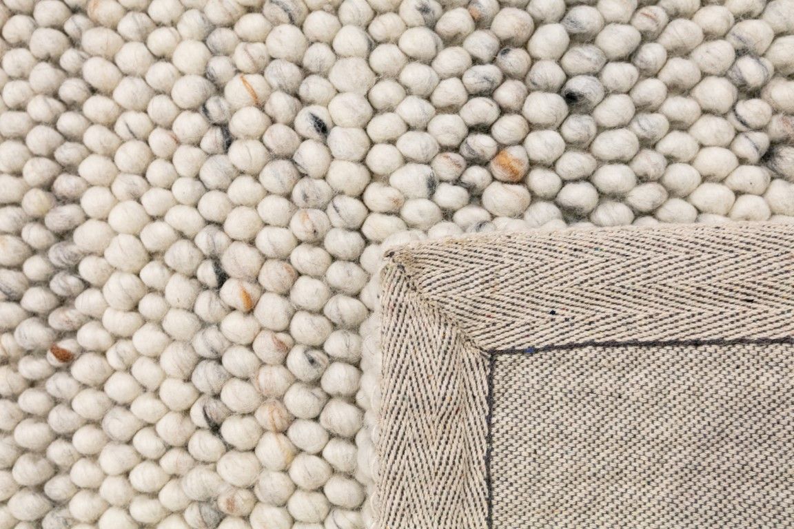 Oslo Greyology 3562 is a textured hand woven,  looped piled wool rug. Colours white with grey,  black and brown accents. Sizes 155 X 225, 200 X 290, 240 X 320 and 300 X 400. Fold.