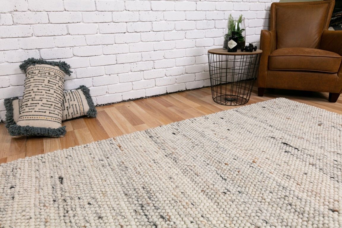 Oslo Greyology 3562 is a textured hand woven,  looped piled wool rug. Colours white with grey,  black and brown accents. Sizes 155 X 225, 200 X 290, 240 X 320 and 300 X 400. Life.