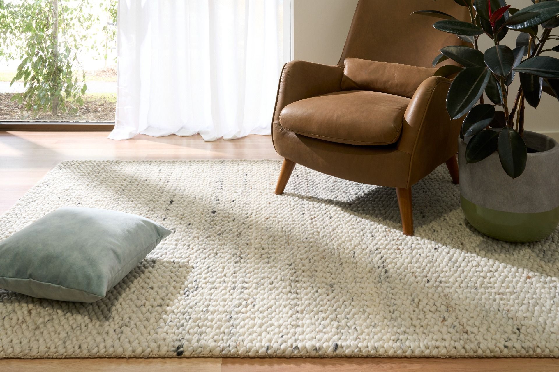 Oslo Greyology 1364 is a textured hand woven, piled loop wool rug. Colours white with grey,  black and brown accents. Sizes 155 X 225, 200 X 290, 240 X 320 and 300 X 400. Room.