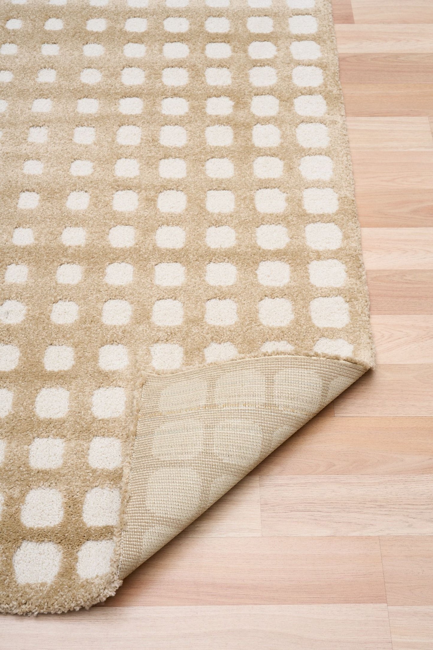 Osmond Squares Beige rug with soft square patterns in a neutral palette and a high-low textured finish. Colours Beige and Cream. Sizes 160 X 230, 200 X 290 and 240 X 340. Fold.