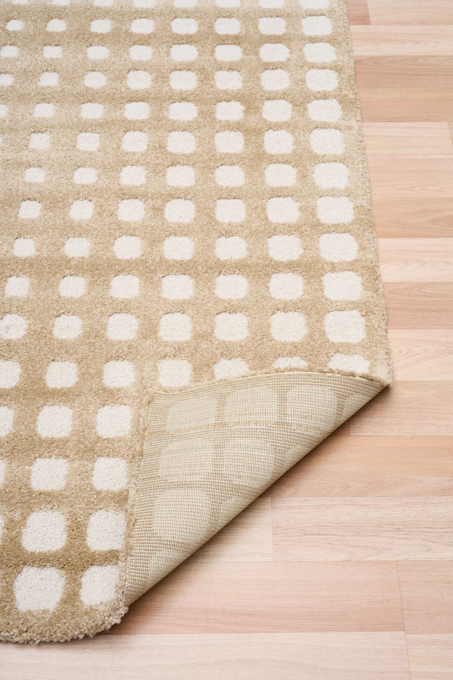 Osmond Squares Beige rug with soft square patterns in a neutral palette and a high-low textured finish. Colours Beige and Cream. Sizes 160 X 230, 200 X 290 and 240 X 340. Fold.