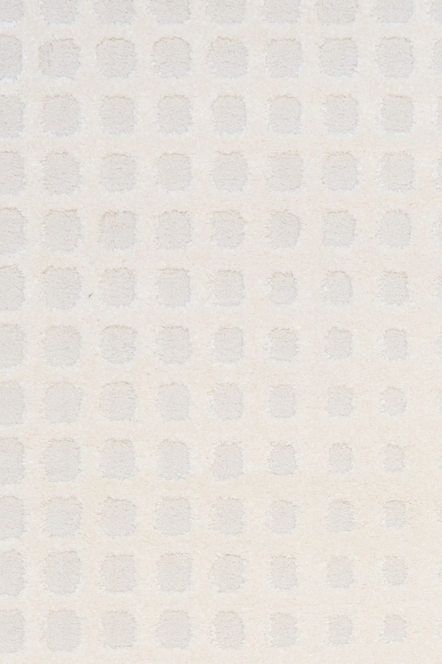 Osmond Squares Ivory rug with soft square patterns in a neutral palette and a high-low textured finish. Colours Ivory and Light Grey. Sizes 160 X 230, 200 X 290 and 240 X 340. Top Close.