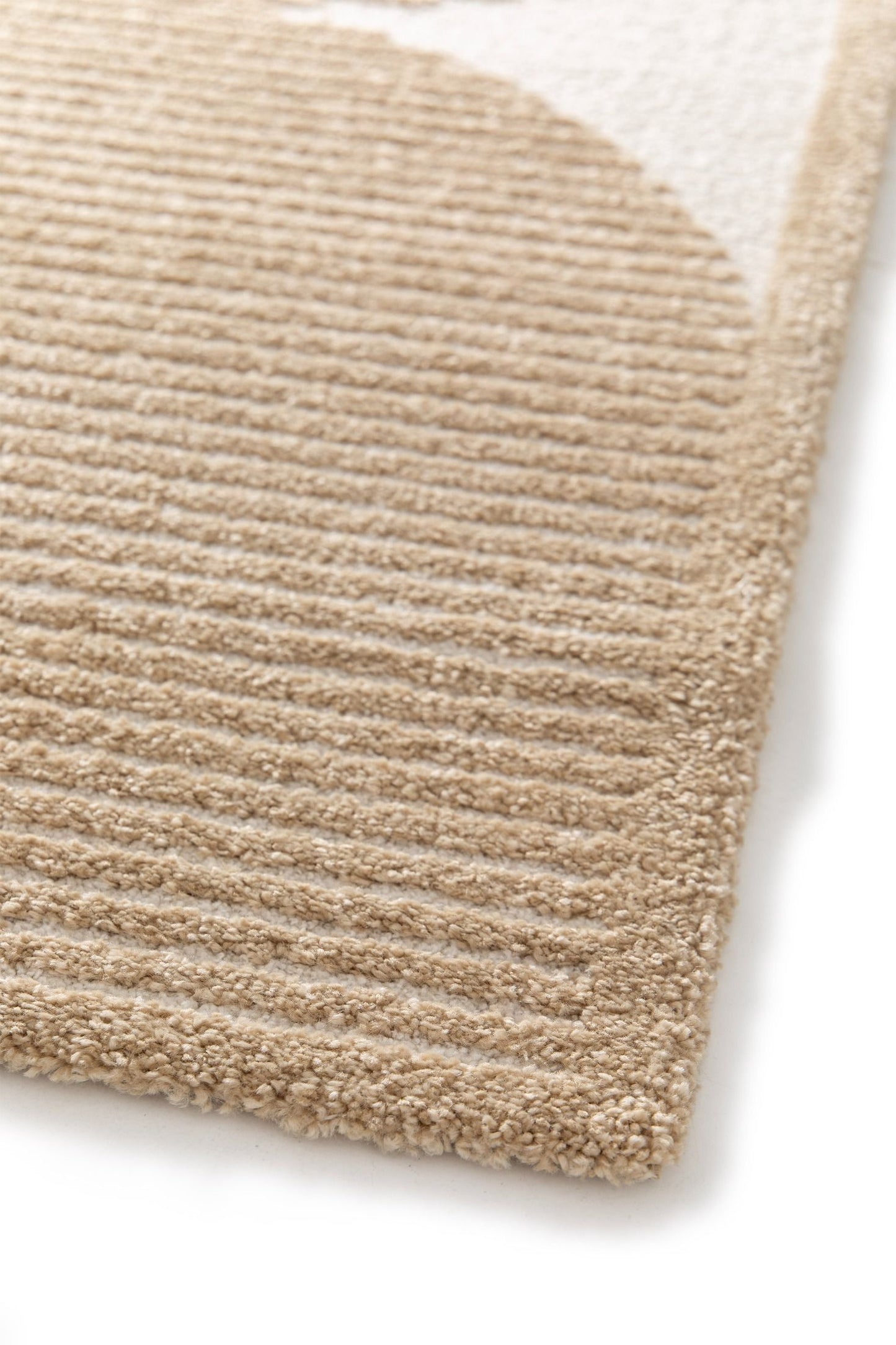 Osmond Waves Beige rug with soft geometric patterns in a neutral palette and a high-low textured finish. Colour Beige and Cream. Sizes 160 X 230, 200 X 290 and 240 X 340. Angle Corner.