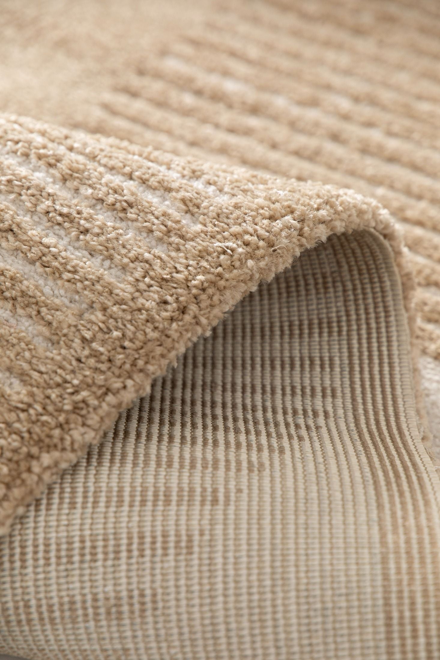 Osmond Waves Beige rug with soft geometric patterns in a neutral palette and a high-low textured finish. Colour Beige and Cream. Sizes 160 X 230, 200 X 290 and 240 X 340. Fold.