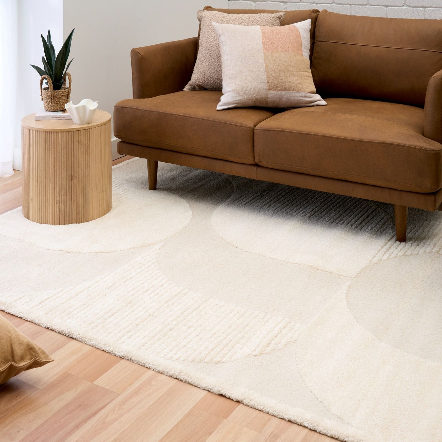 Osmond Waves Ivory rug with soft geometric patterns in a neutral palette and a high-low textured finish. Colours Ivory and Light Grey. Sizes 160 X 230, 200 X 290 and 240 X 340. Life.