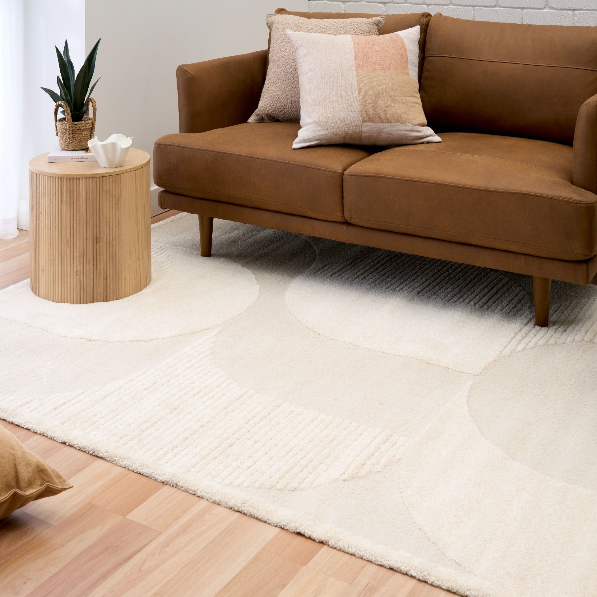 Osmond Waves Ivory rug with soft geometric patterns in a neutral palette and a high-low textured finish. Colours Ivory and Light Grey. Sizes 160 X 230, 200 X 290 and 240 X 340. Life.