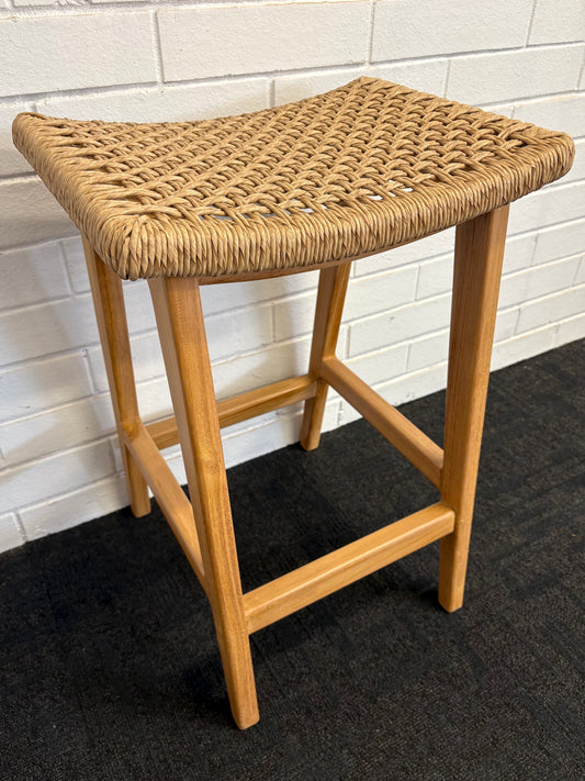 The Owyhee Barstool boasts a coastal contemporary feel. Crafted from sustainable solid teak and featuring a synthetic rope seat. Colour natural. Measures 460 wide X 350 depth X 670 seat height. Angle.