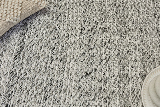 Oxford Grey is a hand-braided rug with a contemporary design. Crafted with wool and polyester for a textured feel, the rug has a pile height of 7-9mm. Colour White,Grey and Black. Sizes 160 X 230, 200 X 290, 240 X 340 and 300 X 400. Life.