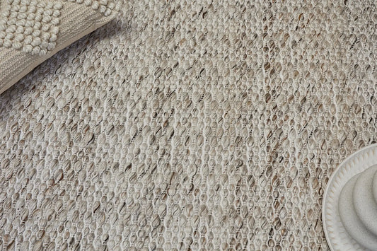 Oxford Taupe is a hand-braided rug with a contemporary design. Crafted with wool and polyester for a textured feel, the rug has a pile height of 7-9mm. Colour Cream with brownish accents. Sizes 160 X 230, 200 X 290, 240 X 340 and 300 X 400. Life.