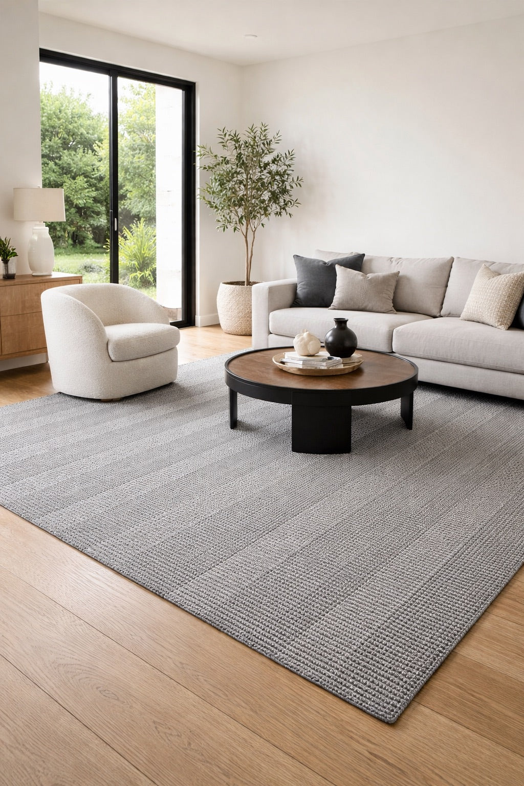 A PET Yarn Hand Woven Flatweave Rug Styled in a modern Perth Living room setting.