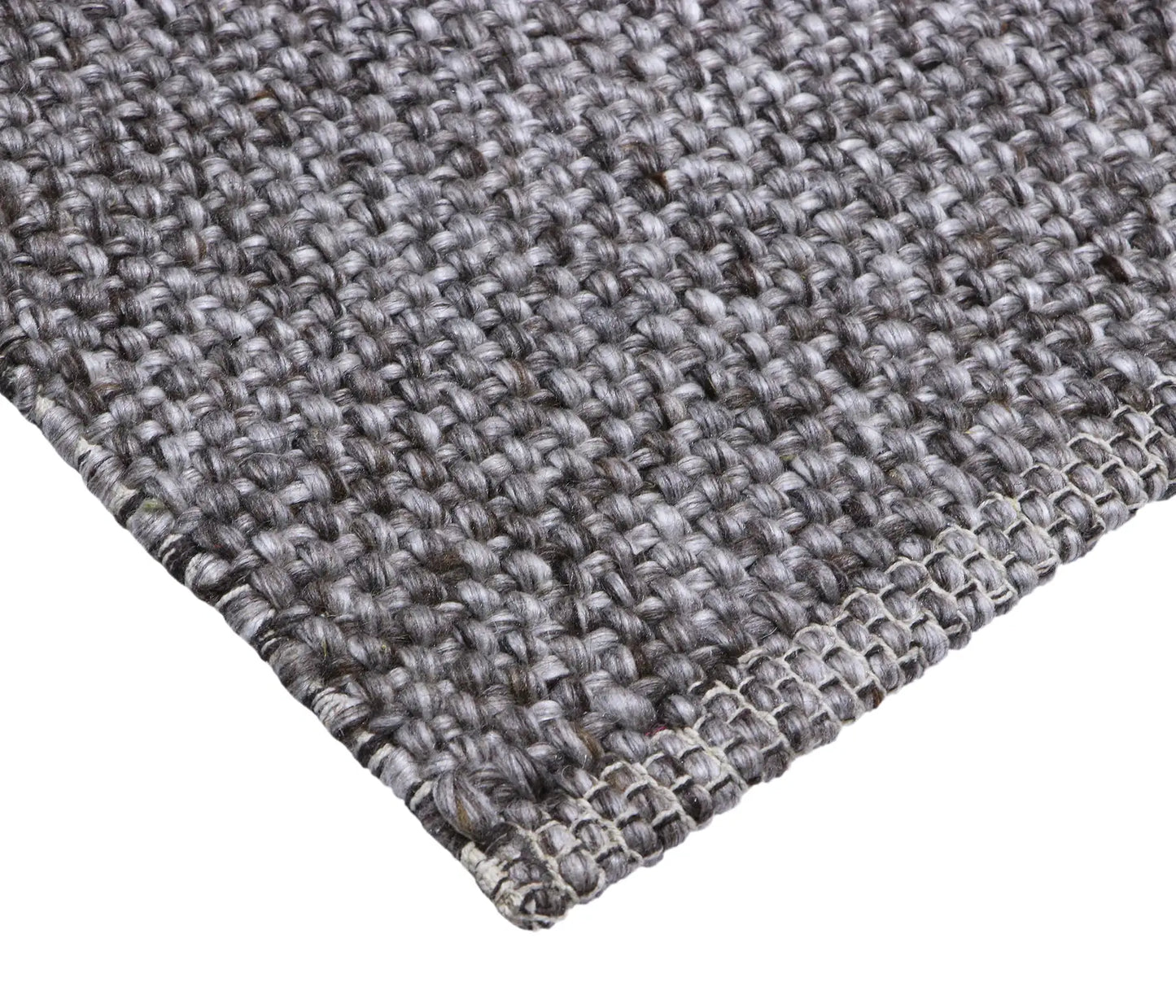 Pacific Brown is a handwoven wool and polyester rug with a low-textured cross weave. It boasts a soft pile height of 7-9mm. Colour brown and grey. Sizes 160 X 230, 200 X 290, 240 X 340 and 300 X 400. Corner.