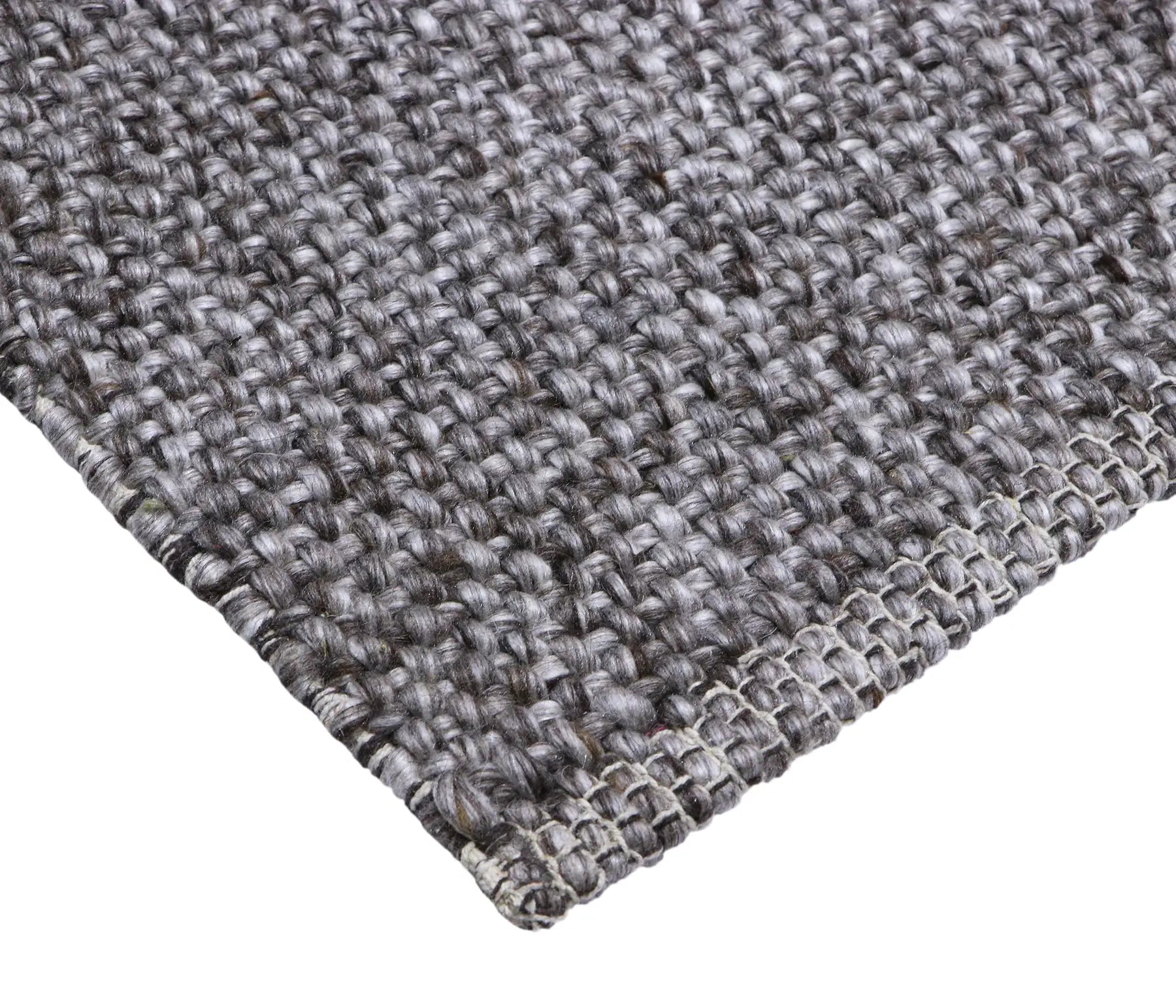 Pacific Brown is a handwoven wool and polyester rug with a low-textured cross weave. It boasts a soft pile height of 7-9mm. Colour brown and grey. Sizes 160 X 230, 200 X 290, 240 X 340 and 300 X 400. Corner.