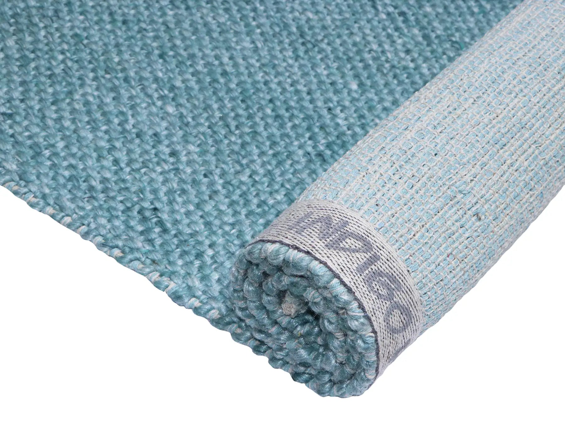 Pacific Green is a handwoven wool and polyester rug with a low-textured cross weave. It boasts a soft pile height of 7-9mm. Colour Aqua Green. Sizes 160 X 230, 200 X 290, 240 X 340 and 300 X 400. Fold/Rolled.