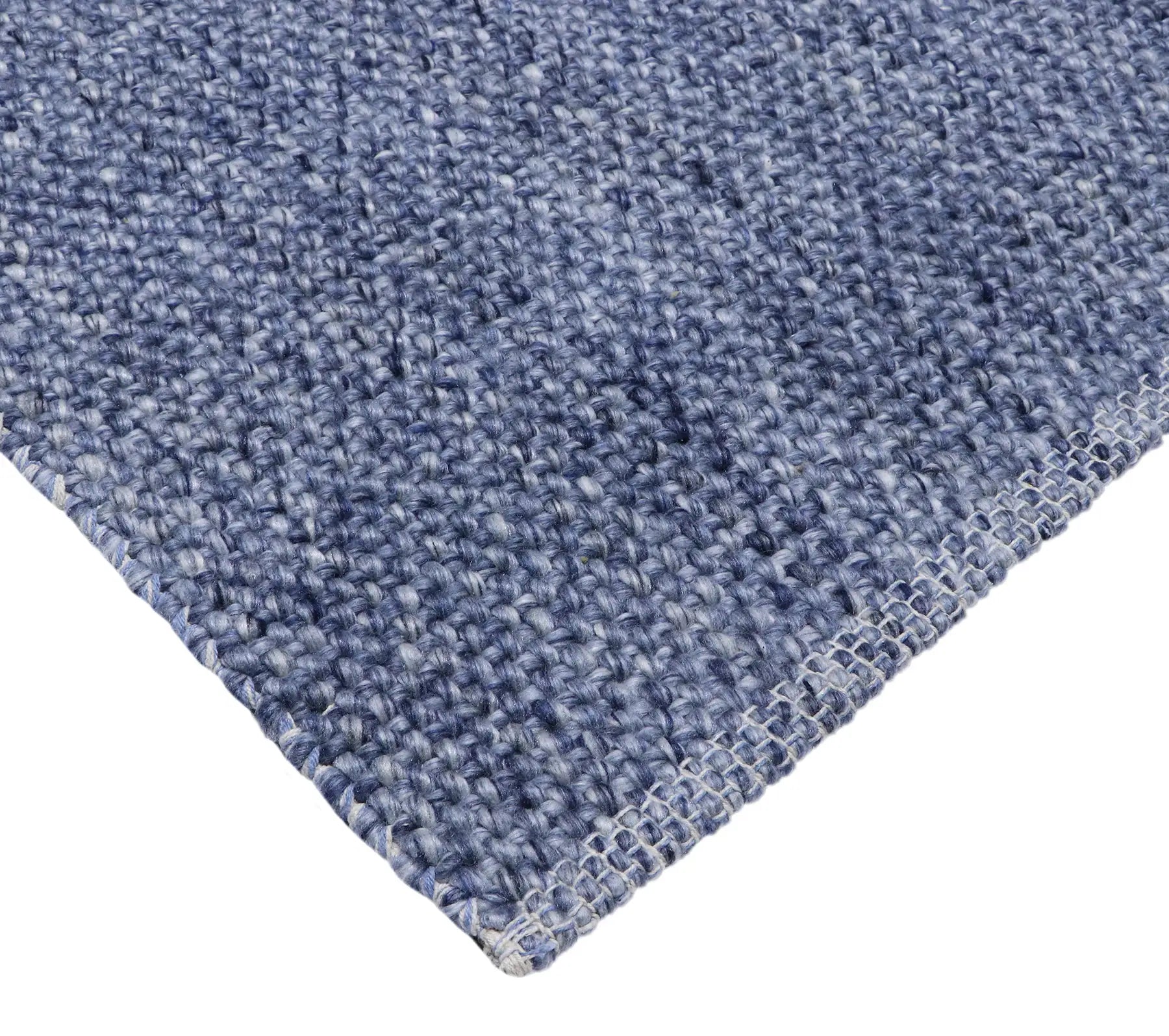 Pacific Navy is a handwoven wool and polyester rug with a low-textured cross weave. It boasts a soft pile height of 7-9mm. Colour Navy blue. Sizes 160 X 230, 200 X 290, 240 X 340 and 300 X 400. Corner.
