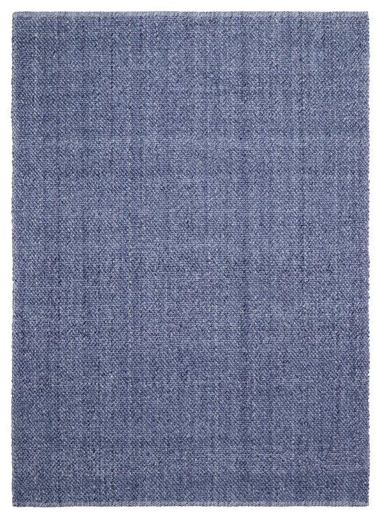Pacific Navy is a handwoven wool and polyester rug with a low-textured cross weave. It boasts a soft pile height of 7-9mm. Colour Navy blue. Sizes 160 X 230, 200 X 290, 240 X 340 and 300 X 400. Full.