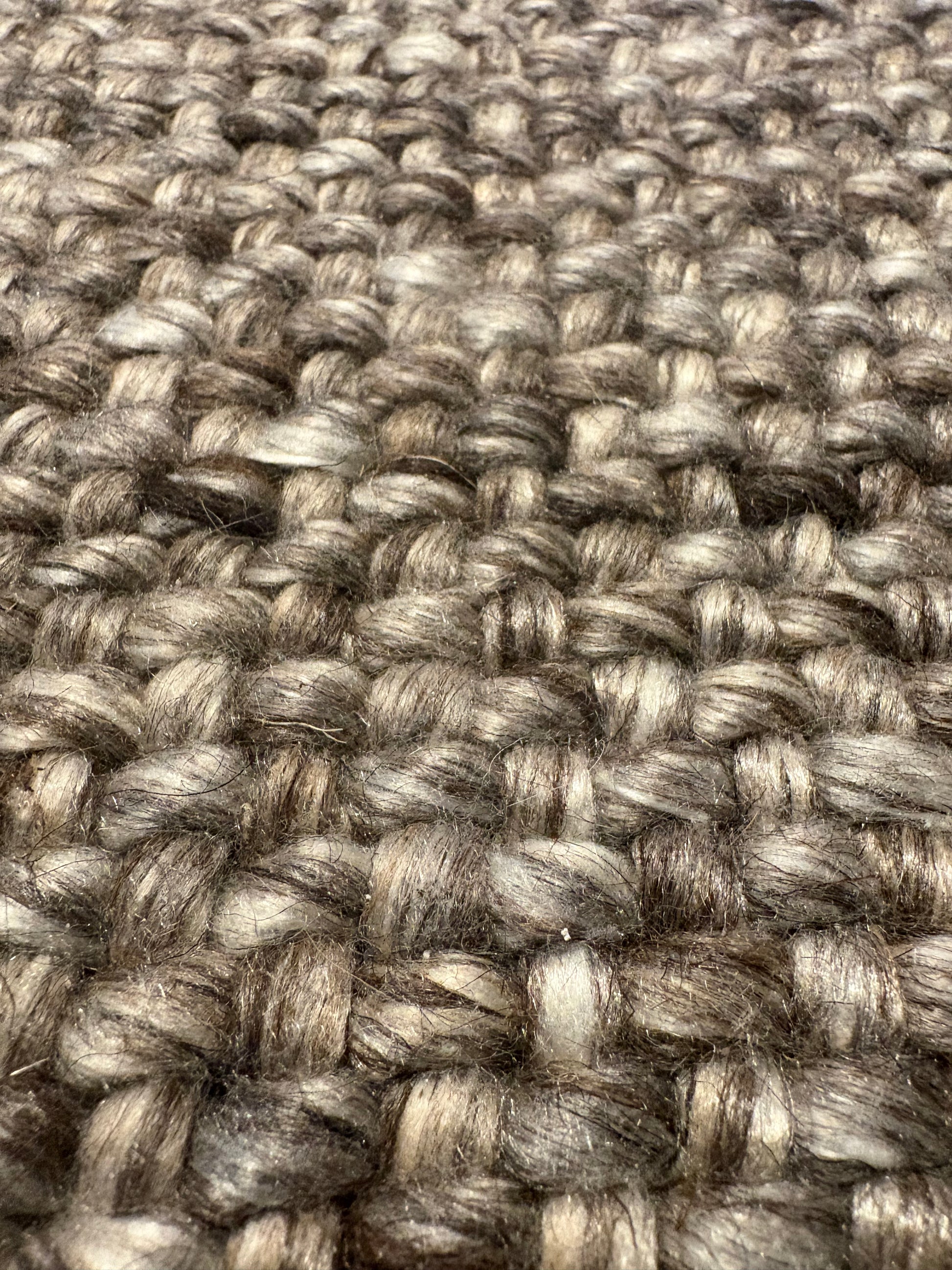 Pacific Brown is a handwoven wool and polyester rug with a low-textured cross weave. It boasts a soft pile height of 7-9mm. Colour brown and grey. Sizes 160 X 230, 200 X 290, 240 X 340 and 300 X 400. Super Close.