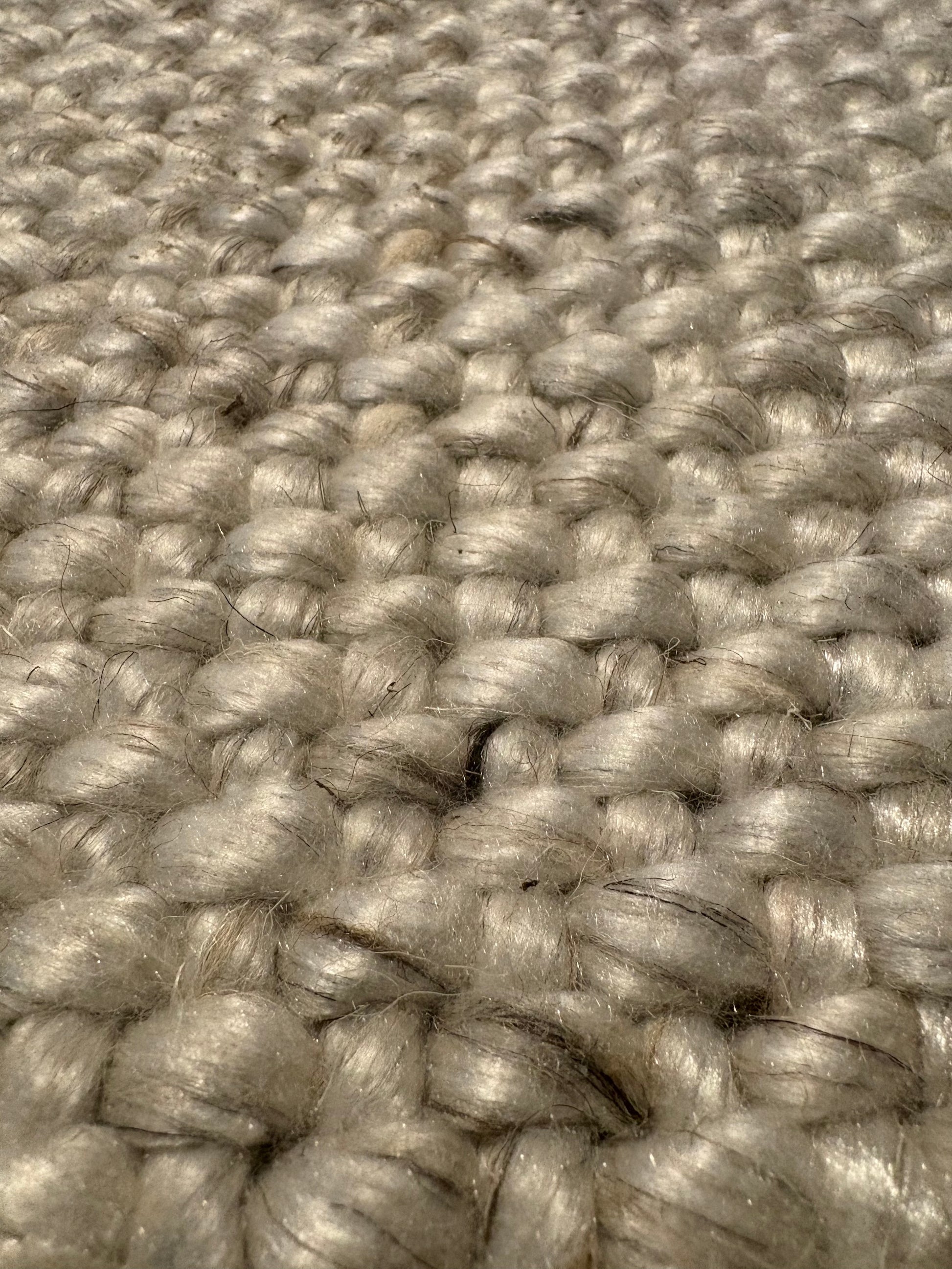 Pacific Grey is a handwoven wool and polyester rug with a low-textured cross weave. It boasts a soft pile height of 7-9mm. Colour White with grey and black accents. Sizes 160 X 230, 200 X 290, 240 X 340 and 300 X 400. Super Close.