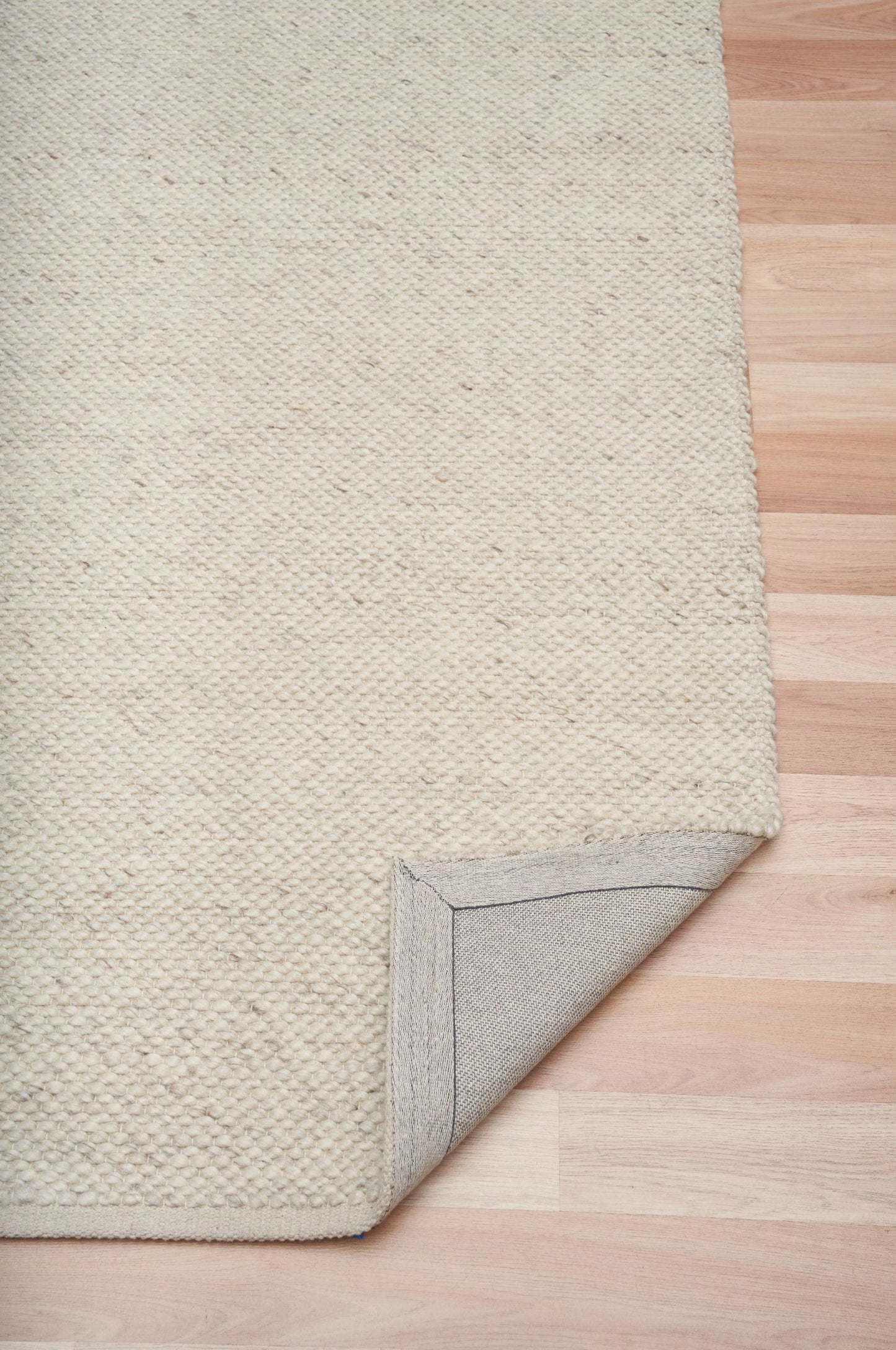 Park Lane Pearl is a contemporary hand woven flatweave rug. Made from 80%  New Zealand Wool and 20% polyester for a soft and slightly textured feel. Colour Pearl. Sizes 155 X 225, 200 X 290, 240 X 320 and 300 X 400. Fold.