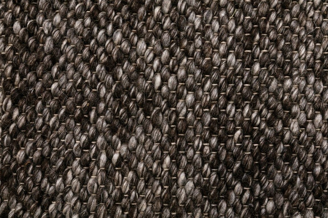 Park Lane Shadow is a contemporary hand woven flatweave rug. Made from 80%  New Zealand Wool and 20% polyester for a soft and slightly textured feel. Colour Blackish Grey. Sizes 155 X 225, 200 X 290, 240 X 320 and 300 X 400. Close.